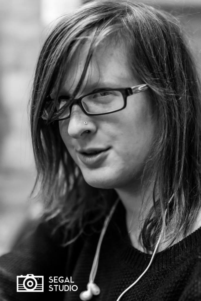 Photo of woman wearing glasses and smiling